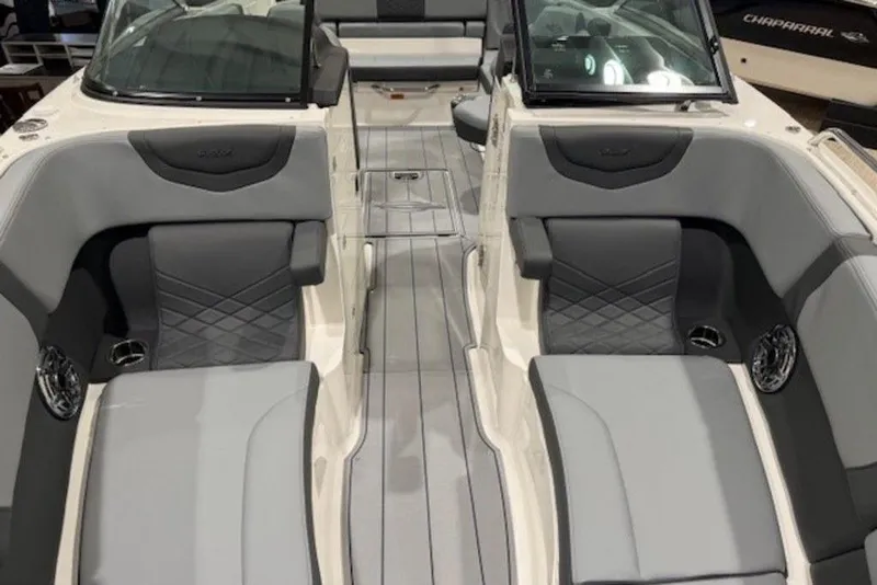 Slide: The Image of 2026 Chaparral 270 OSX boat interior with luxurious seating and modern design. - 23