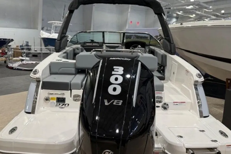 Slide: The Image of 2026 Chaparral 270 OSX boat with Mercury 300 V8 engine in showroom. - 26