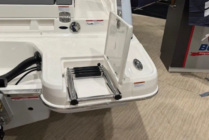 Slide: The Image of 2026 Chaparral 270 OSX boat with foldable swim ladder on deck. - 27