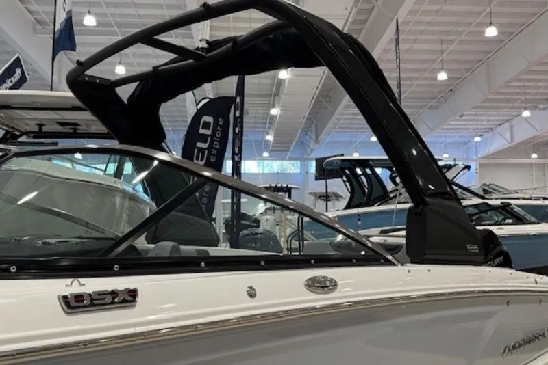 Slide: The Image of 2026 Chaparral 270 OSX boat displayed in a showroom, featuring sleek design and modern features. - 4