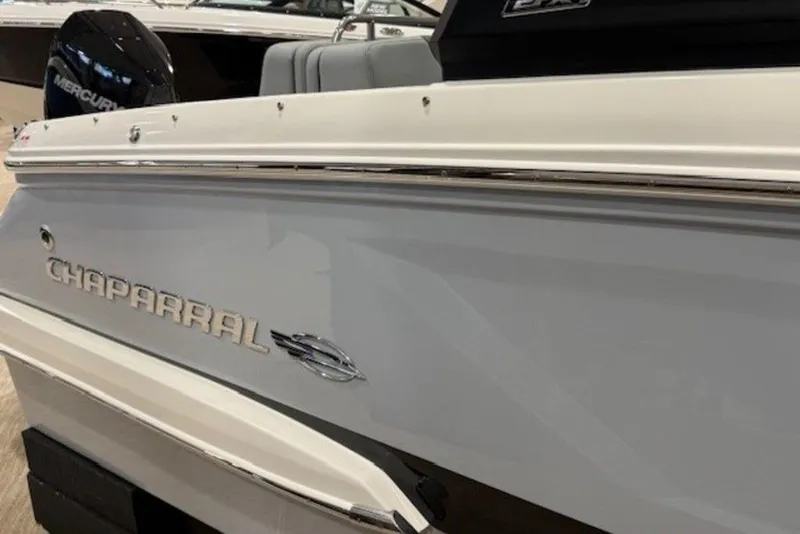 Slide: The Image of 2026 Chaparral 270 OSX boat side view with logo and Mercury engine. - 6