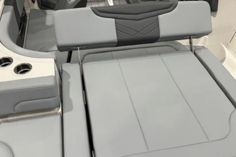 Slide: The Image of 2026 Chaparral 270 OSX boat interior with gray seating and cup holders. - 7