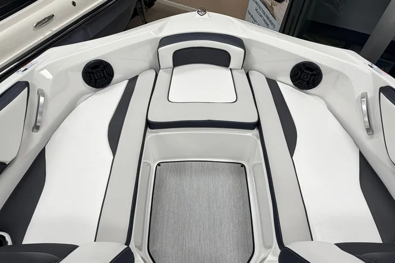 Slide: The Image of 2026 Yamaha Boats AR195 interior seating with sleek white and gray design. - 12