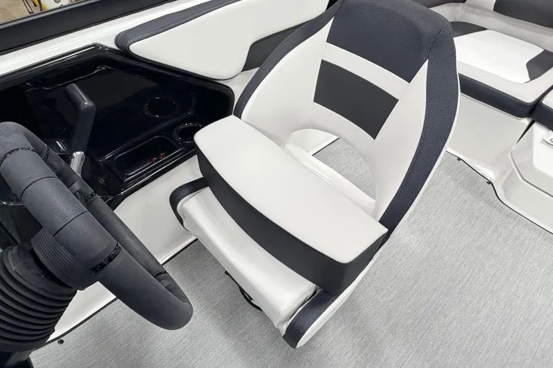 Slide: The Image of 2026 Yamaha Boats AR195 interior with sleek black and white seating and steering wheel. - 13