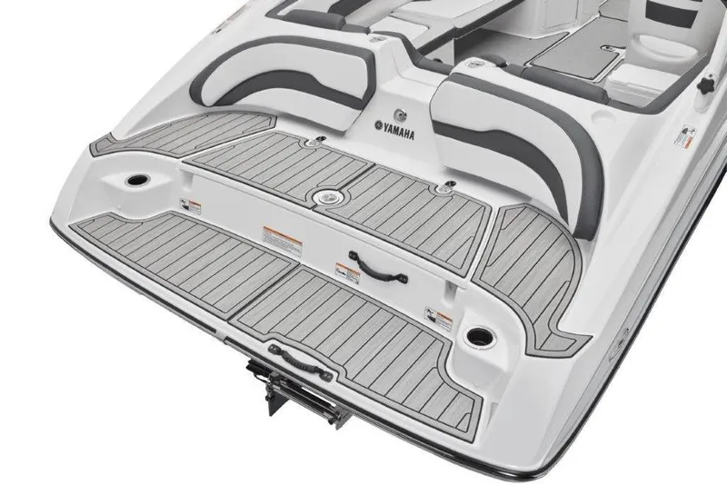 Slide: The Image of 2026 Yamaha Boats AR195 swim platform with cushioned seating and sleek design. - 19