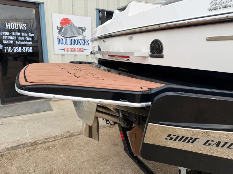 Slide: The Image of Rear of 2021 Malibu Wakesetter 21 MLX with Surf Gate. - 12