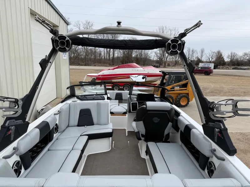Slide: The Image of Interior of a 2021 Malibu Wakesetter 21 MLX boat with modern seating. - 13