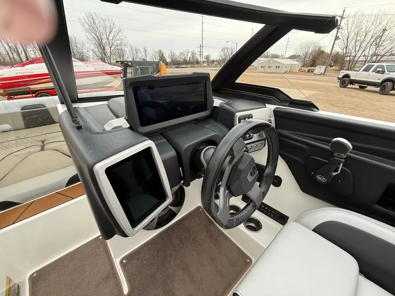 Slide: The Image of Interior of 2021 Malibu Wakesetter 21 MLX with modern control console. - 16
