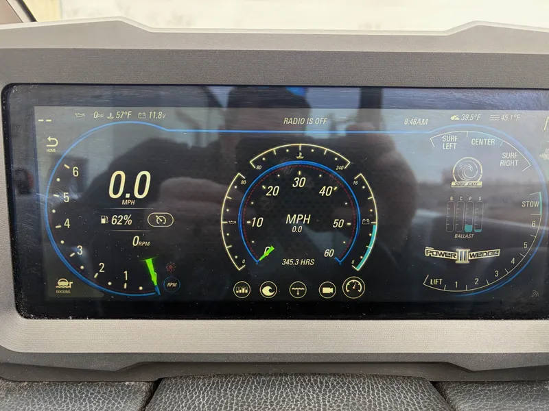 Slide: The Image of Malibu Wakesetter 21 MLX 2021 dashboard with speedometer display. - 19