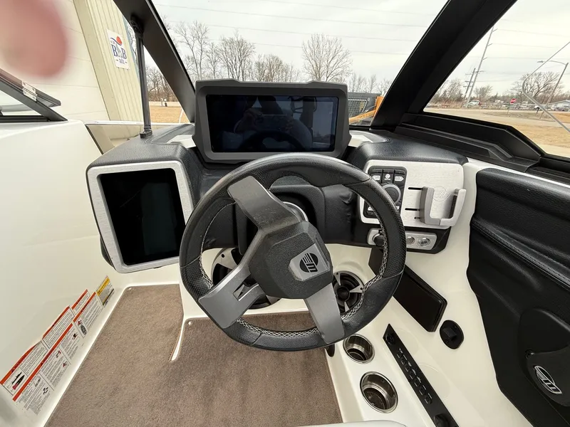 Slide: The Image of Interior view of 2021 Malibu Wakesetter 21 MLX cockpit. - 21
