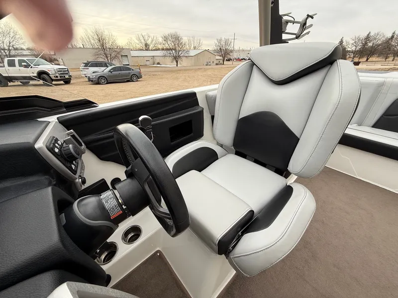 Slide: The Image of Interior of 2021 Malibu Wakesetter 21 MLX with steering wheel and seat. - 22