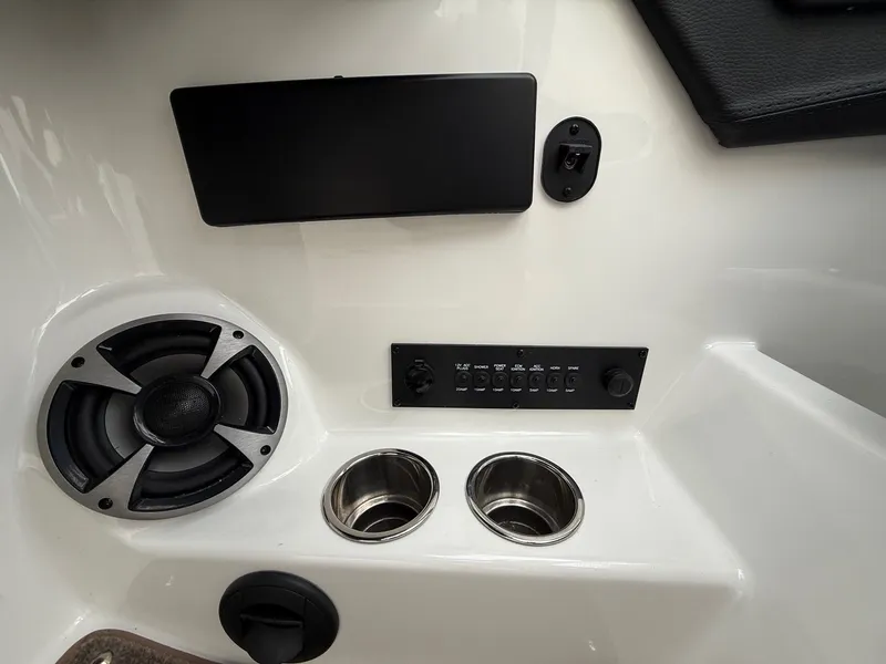 Slide: The Image of Interior view of 2021 Malibu Wakesetter 21 MLX with speaker and controls. - 24