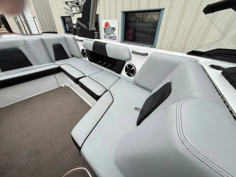 Slide: The Image of Interior of 2021 Malibu Wakesetter 21 MLX with gray upholstery. - 25
