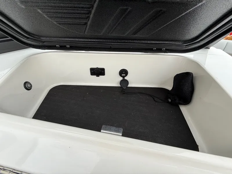 Slide: The Image of Storage compartment in 2021 Malibu Wakesetter 21 MLX boat. - 26
