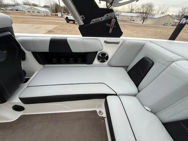 Slide: The Image of Interior of 2021 Malibu Wakesetter 21 MLX with white upholstery. - 28
