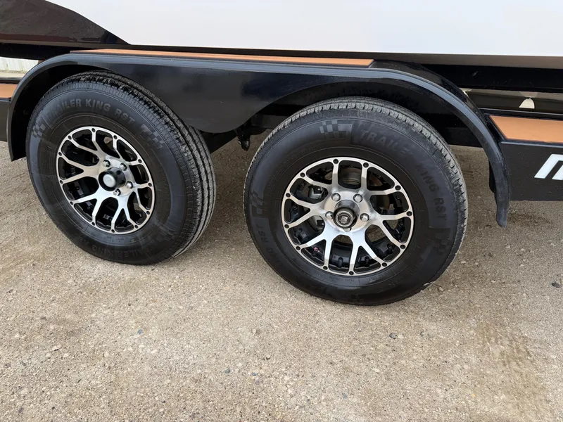 Slide: The Image of 2021 Malibu Wakesetter 21 MLX trailer tires on sandy ground. - 38