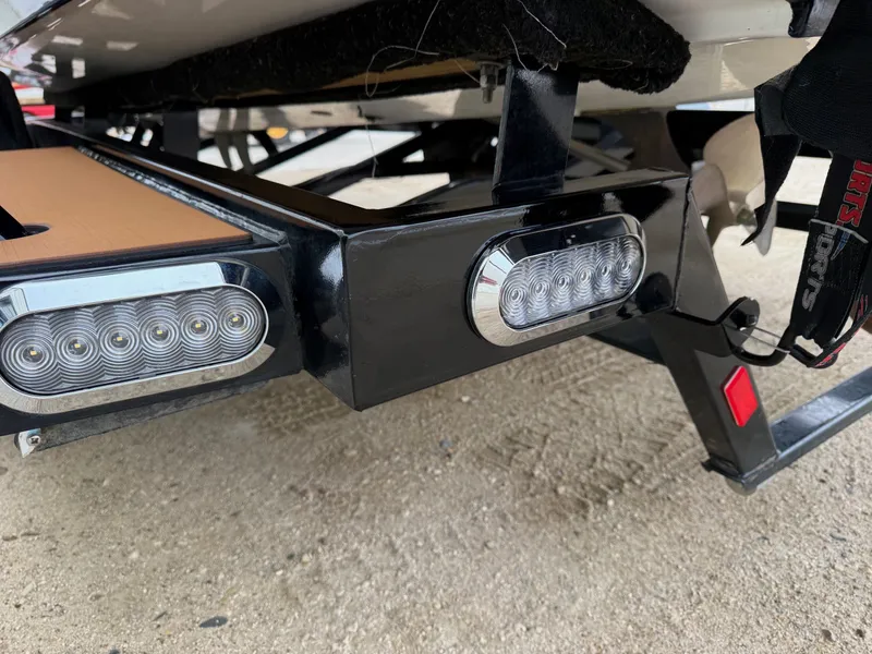 Slide: The Image of Underside of a 2021 Malibu Wakesetter 21 MLX boat with LED lights. - 39