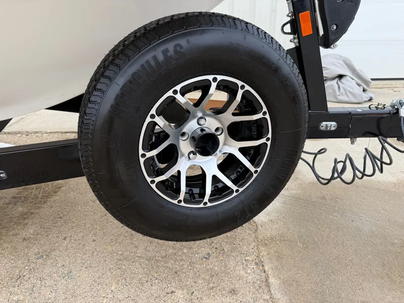 Slide: The Image of Close-up of a 2021 Malibu Wakesetter 21 MLX trailer wheel. - 41
