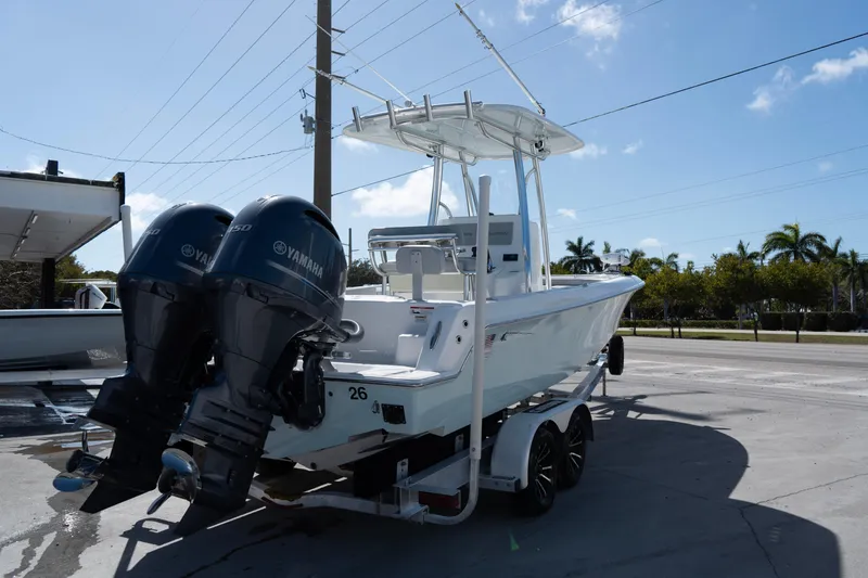 Slide: The Image of 2023 Contender 24 Sport boat with dual Yamaha engines on a trailer. - 4