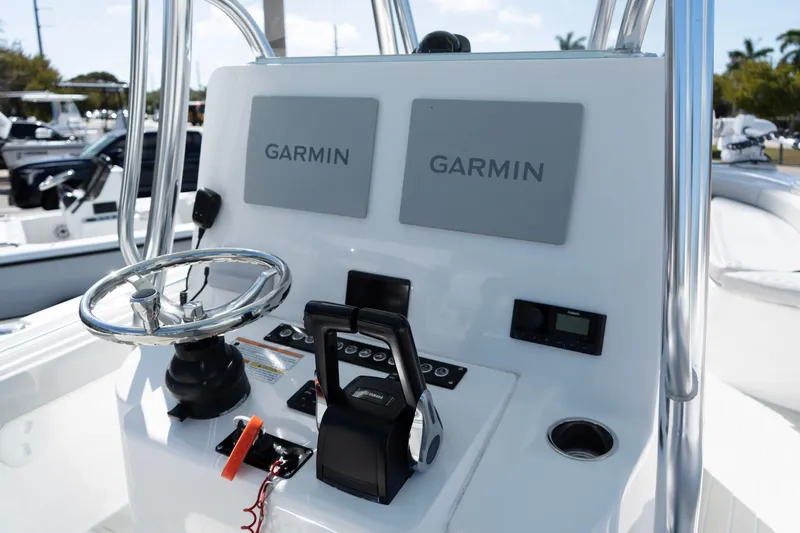 Slide: The Image of 2023 Contender 24 Sport boat dashboard with Garmin navigation system. - 9