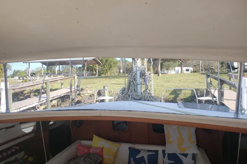 Slide: The Image of Interior view of a 2006 Gemini 105 MC catamaran with outdoor scenery. - 10