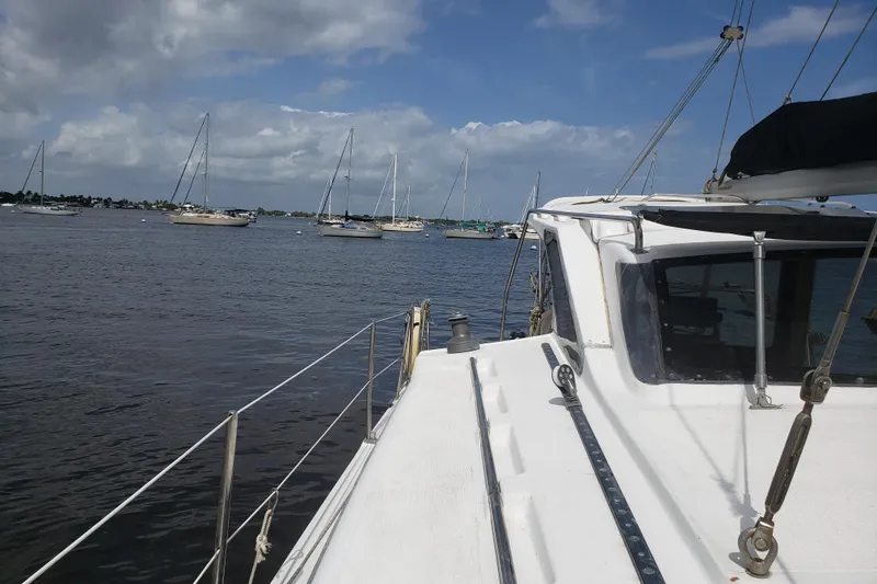 Slide: The Image of Sailboats on calm water viewed from a 2006 Gemini 105 MC catamaran deck. - 11