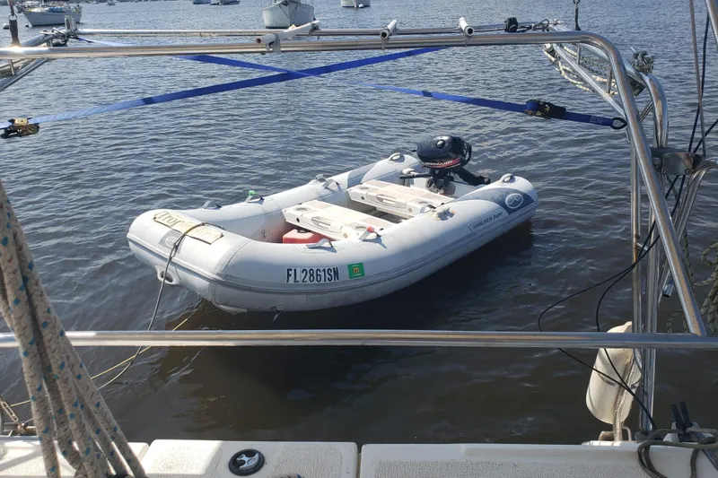 Slide: The Image of Inflatable boat on water, viewed from a 2006 Gemini 105 MC catamaran. - 13