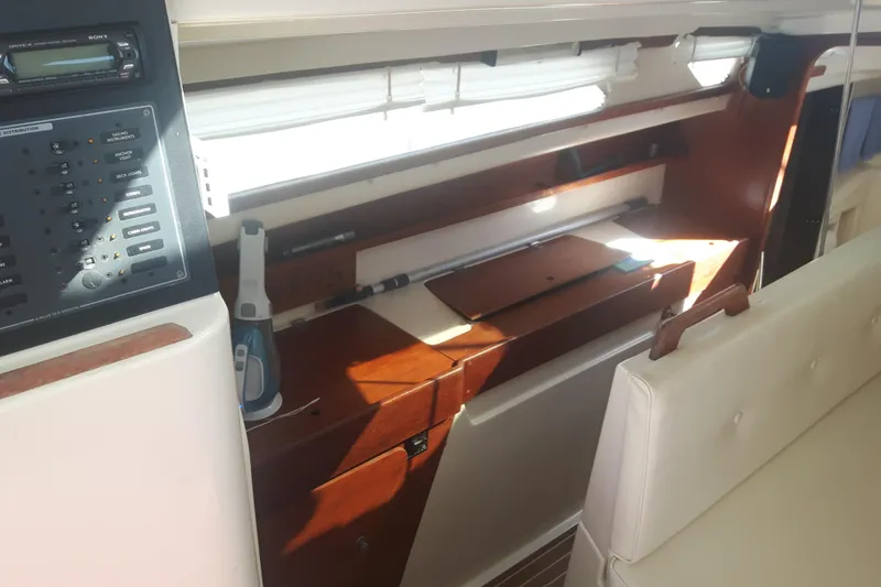 Slide: The Image of Interior of a 2006 Gemini 105 MC sailboat with control panel and seating area. - 3