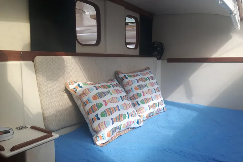 Slide: The Image of Cozy interior of 2006 Gemini 105 MC sailboat with colorful fish-patterned pillows. - 5