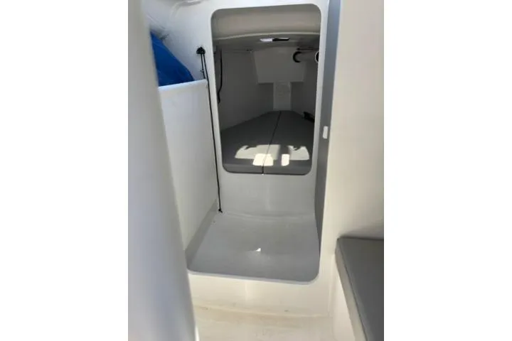 Slide: The Image of 2024 Beneteau First 27 interior cabin view, showcasing modern design and spacious layout. - 10