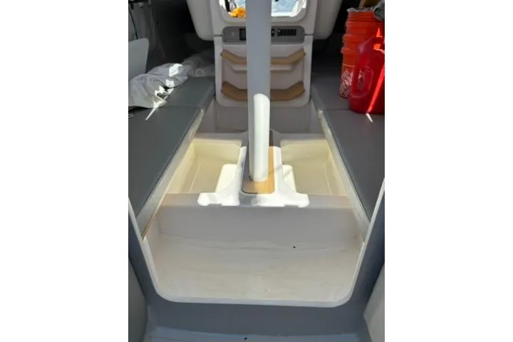 Slide: The Image of Interior of 2024 Beneteau First 27 sailboat, featuring modern design and storage compartments. - 11