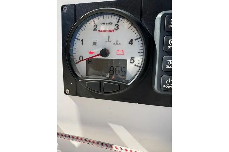 Slide: The Image of Close-up of Yanmar RPM gauge on 2024 Beneteau First 27 sailboat. - 14