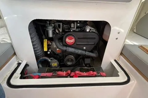 Slide: The Image of 2024 Beneteau First 27 engine compartment, showcasing compact and efficient design. - 9