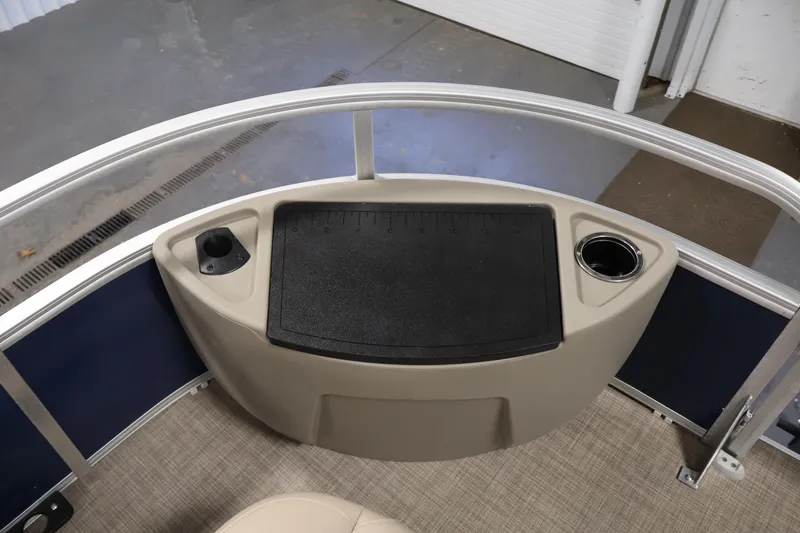 Slide: The Image of 2023 Sun Tracker Fishin' Barge 20 DLX deck with cup holder and storage area. - 12