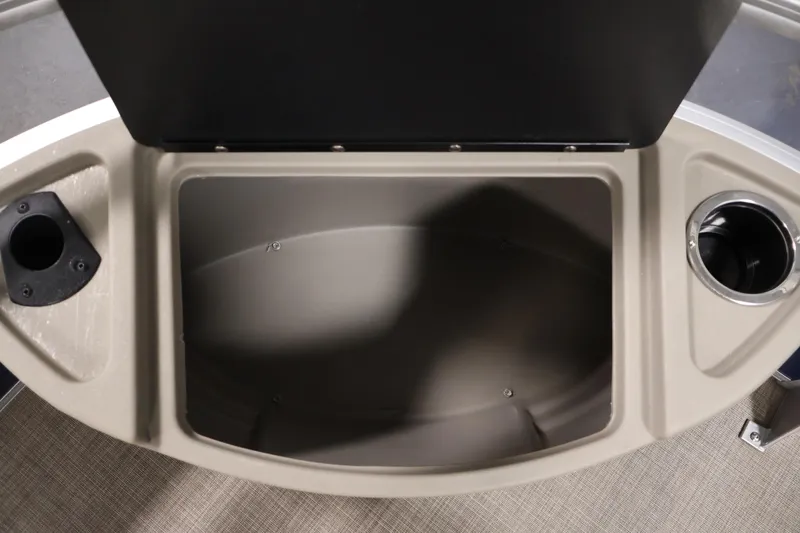 Slide: The Image of 2023 Sun Tracker Fishin' Barge 20 DLX storage compartment with cup holders. - 13