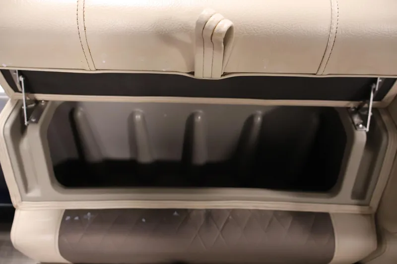 Slide: The Image of Open storage compartment in 2023 Sun Tracker Fishin' Barge 20 DLX boat. - 21