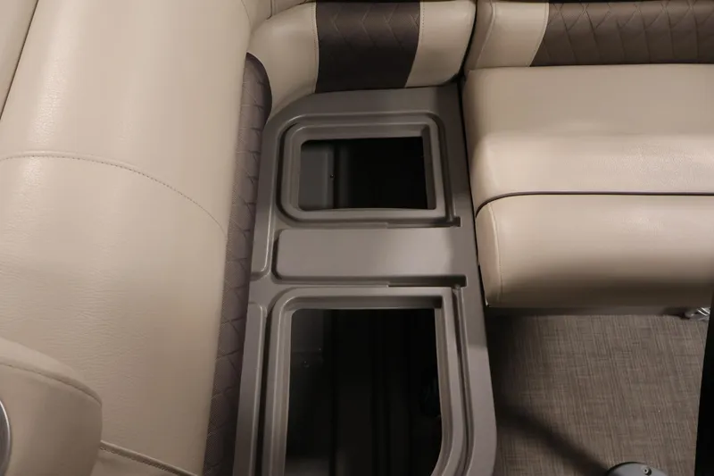 Slide: The Image of 2023 Sun Tracker Fishin' Barge 20 DLX interior seating with storage compartments. - 40