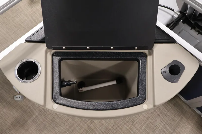 Slide: The Image of 2023 Sun Tracker Fishin' Barge 20 DLX storage compartment with cup holders and accessories. - 45