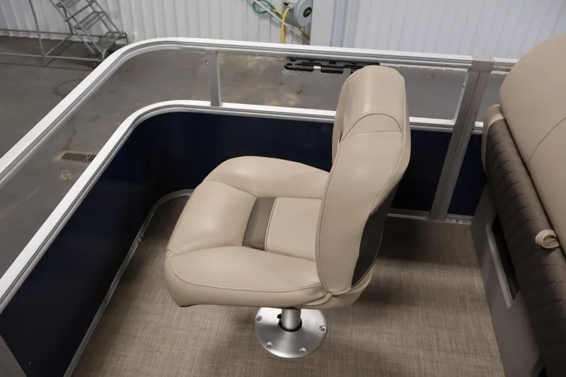 Slide: The Image of 2023 Sun Tracker Fishin' Barge 20 DLX, beige seat detail, interior view. - 47
