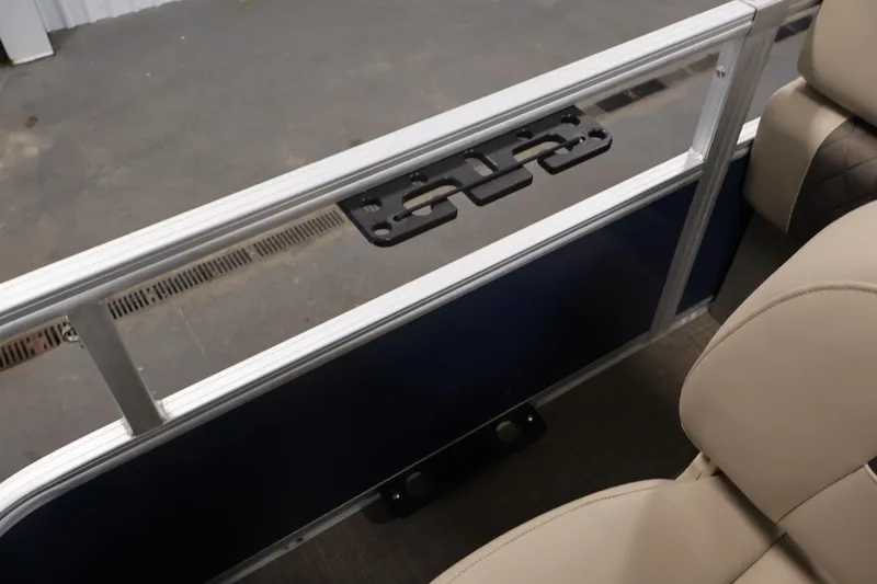 Slide: The Image of 2023 Sun Tracker Fishin' Barge 20 DLX interior with beige seating and railing detail. - 48