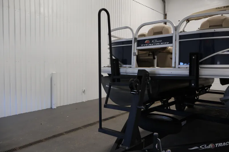 Slide: The Image of 2023 Sun Tracker Fishin' Barge 20 DLX pontoon boat in a garage. - 54