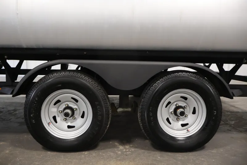 Slide: The Image of Trailer wheels of a 2023 Sun Tracker Fishin' Barge 20 DLX pontoon boat. - 58