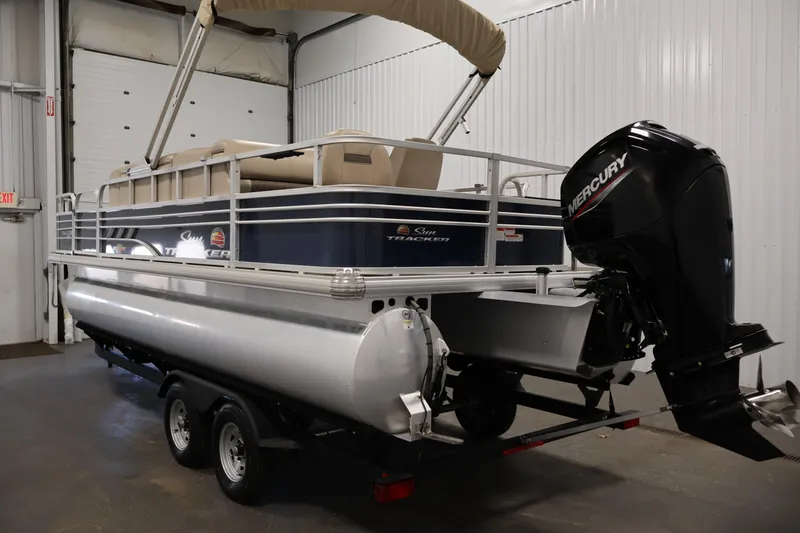 Slide: The Image of 2023 Sun Tracker Fishin' Barge 20 DLX pontoon boat with Mercury outboard motor. - 7