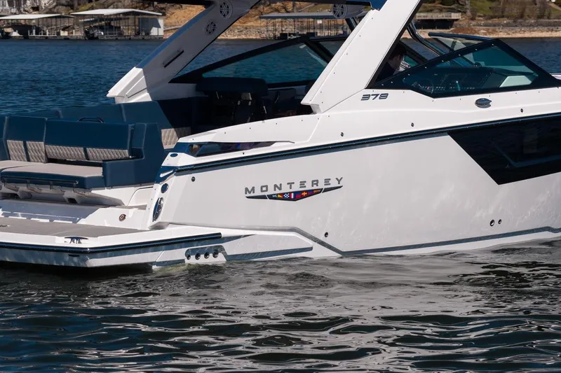Slide: The Image of 2026 Monterey 378SS Super Sport boat on water, showcasing sleek design and luxury features. - 13