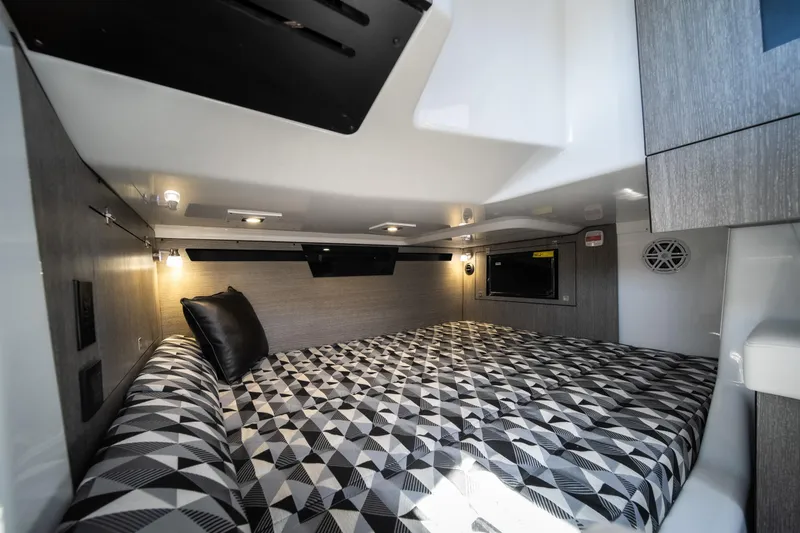 Slide: The Image of Interior cabin of 2026 Monterey 378SS Super Sport with geometric-patterned bedding. - 15