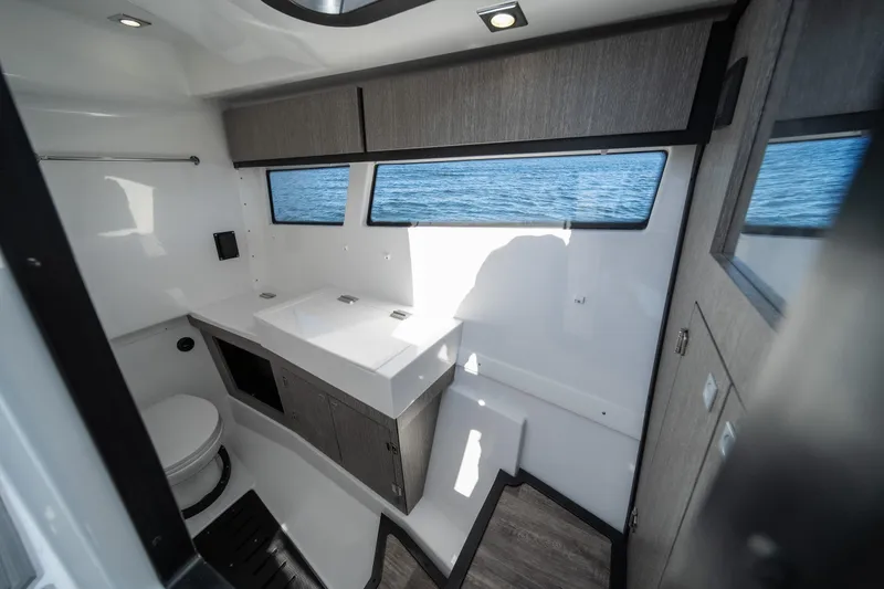 Slide: The Image of Luxurious interior of 2026 Monterey 378SS Super Sport boat with modern bathroom design. - 17