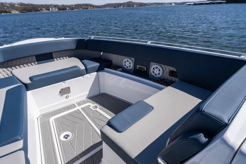 Slide: The Image of Luxurious seating area on 2026 Monterey 378SS Super Sport boat, overlooking serene water. - 19