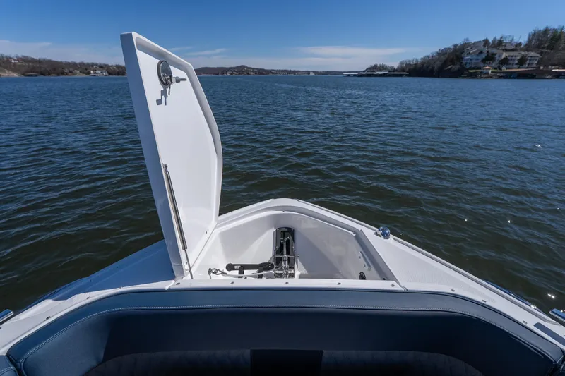 Slide: The Image of 2026 Monterey 378SS Super Sport boat on a serene lake with open hatch. - 21
