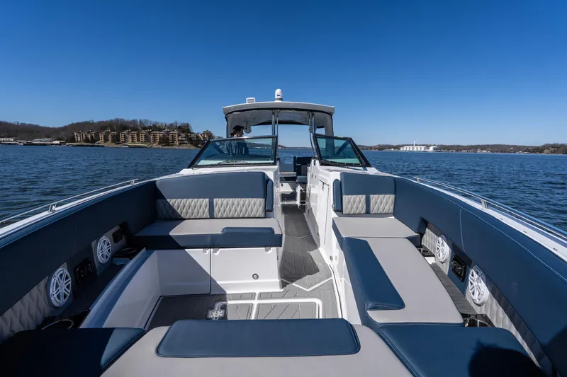 Slide: The Image of 2026 Monterey 378SS Super Sport boat interior with luxurious seating on a sunny day. - 22