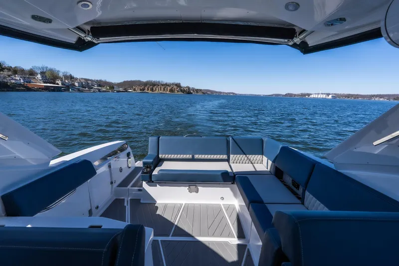 Slide: The Image of 2026 Monterey 378SS Super Sport boat interior with blue seating on open water. - 23